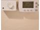 Close up of a digital thermostat on a wall at 4801 Osprey S Dr # 209, St Petersburg, FL 33711
