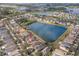 Aerial view of a beautiful home on a lake in a well-planned suburban neighborhood at 5236 Clover Mist Dr, Apollo Beach, FL 33572