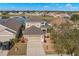 Aerial view of a well-maintained two-story home with a landscaped yard and pond views at 5236 Clover Mist Dr, Apollo Beach, FL 33572