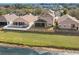 This home boasts a large screened-in porch and fenced backyard with stunning water views at 5236 Clover Mist Dr, Apollo Beach, FL 33572