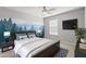 Cozy bedroom featuring a large mural, plush bed, and ample natural light at 5236 Clover Mist Dr, Apollo Beach, FL 33572