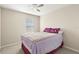 Neutral bedroom with a ceiling fan and a window with white blinds at 5236 Clover Mist Dr, Apollo Beach, FL 33572