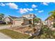 Beautifully landscaped front exterior of a two-story home featuring a well manicured lawn and a two-car garage at 5236 Clover Mist Dr, Apollo Beach, FL 33572