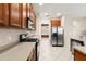 Well-lit kitchen with stainless steel refrigerator and oven and granite countertops at 5236 Clover Mist Dr, Apollo Beach, FL 33572