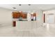 Spacious kitchen featuring stainless steel appliances, tile flooring, and an eat-in island at 5236 Clover Mist Dr, Apollo Beach, FL 33572
