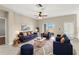 Spacious living room featuring comfortable seating, a rug, and sliding glass doors at 5236 Clover Mist Dr, Apollo Beach, FL 33572
