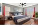 Comfortable main bedroom featuring a large bed, stylish furnishings, and natural light at 5236 Clover Mist Dr, Apollo Beach, FL 33572