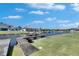 Waterfront backyard view with a private dock and boat lift, perfect for enjoying water activities at 5326 Loon Nest Ct, Apollo Beach, FL 33572