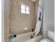 Bathroom featuring a bathtub with tiled walls and a showerhead at 5326 Loon Nest Ct, Apollo Beach, FL 33572