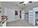 Well-lit bedroom with closet space, carpeted floors, and a loft bed at 5326 Loon Nest Ct, Apollo Beach, FL 33572