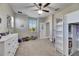 Comfortable bedroom with ample natural light, built-in storage, and carpeted floors at 5326 Loon Nest Ct, Apollo Beach, FL 33572