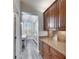 Charming butler pantry featuring custom cabinetry, granite countertops, and convenient access to the dining area at 5326 Loon Nest Ct, Apollo Beach, FL 33572