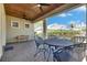 Spacious covered patio with ceiling fans, brick flooring, and outdoor dining area, perfect for entertaining at 5326 Loon Nest Ct, Apollo Beach, FL 33572