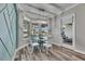 Bright dining area features wood floors, stylish decor, and access to the patio at 5326 Loon Nest Ct, Apollo Beach, FL 33572