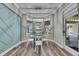 Dining room with bay window, modern lighting, and stylish decor at 5326 Loon Nest Ct, Apollo Beach, FL 33572