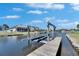 Private boat dock with a lift on the canal at 5326 Loon Nest Ct, Apollo Beach, FL 33572