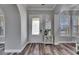 Inviting foyer featuring decorative glass door, stylish flooring, and elegant furnishings at 5326 Loon Nest Ct, Apollo Beach, FL 33572