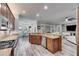 Open concept kitchen featuring granite countertops, stainless appliances, and a view of the living space at 5326 Loon Nest Ct, Apollo Beach, FL 33572