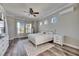 Serene main bedroom with ceiling fan, wood floors, and plenty of natural light at 5326 Loon Nest Ct, Apollo Beach, FL 33572