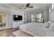 Relaxing main bedroom featuring neutral tones, wood floors, and ample natural light at 5326 Loon Nest Ct, Apollo Beach, FL 33572