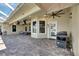 Outdoor patio with comfortable seating, ceiling fan, TV, and an outdoor grill at 5326 Loon Nest Ct, Apollo Beach, FL 33572