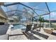 Screened-in pool area with a water feature and outdoor seating at 5326 Loon Nest Ct, Apollo Beach, FL 33572