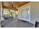 Covered front porch with a ceiling fan and seating area at 5326 Loon Nest Ct, Apollo Beach, FL 33572