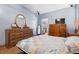 Bedroom with hardwood floors, neutral walls and a view to other rooms at 6131 Central Ave, New Port Richey, FL 34653