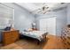 Bedroom with hardwood floors, ceiling fan, and a large closet at 6131 Central Ave, New Port Richey, FL 34653