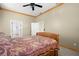 Traditional bedroom with a queen bed, neutral walls, and carpet flooring at 6131 Central Ave, New Port Richey, FL 34653