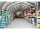 Spacious metal garage with shelving units and ample storage space for tools and equipment at 6131 Central Ave, New Port Richey, FL 34653