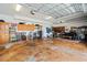 Spacious garage with modern laundry appliances, ample storage, and a comfortable seating area for relaxation at 6131 Central Ave, New Port Richey, FL 34653