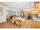 Spacious kitchen featuring stainless steel appliances, wood cabinetry, and an island with seating at 6131 Central Ave, New Port Richey, FL 34653