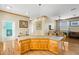 Kitchen showcasing center island with seating, wood trim, and plenty of space at 6131 Central Ave, New Port Richey, FL 34653