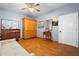 Living room with hardwood floors, ceiling fan, and neutral paint color at 6131 Central Ave, New Port Richey, FL 34653