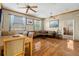 Open-concept living area with wood floors and lots of natural light at 6131 Central Ave, New Port Richey, FL 34653