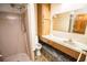 Bathroom needing renovation with shower, toilet, vanity and mirror at 625 Kingston Ct, Apollo Beach, FL 33572