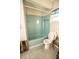 Dated bathroom featuring blue tile flooring and a blue shower-tub combo at 625 Kingston Ct, Apollo Beach, FL 33572