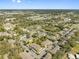Extensive aerial view of the community, showcasing diverse housing options amidst trees and neighborhood amenities at 6262 Maisie Rd, Zephyrhills, FL 33542
