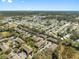 Extensive aerial view of the community, showcasing diverse housing options amidst trees and neighborhood amenities at 6262 Maisie Rd, Zephyrhills, FL 33542