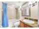 Bathroom featuring bath tub, shower and granite vanity countertop with sink at 6262 Maisie Rd, Zephyrhills, FL 33542