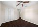 Bedroom featuring carpet floors, closet, and ceiling fan at 6262 Maisie Rd, Zephyrhills, FL 33542
