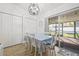 Dining room with white table, blue cloth and a light fixture at 6268 105Th N Ter, Pinellas Park, FL 33782