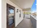 Exterior balcony with railing and front door at 716 Cordova Grn, Seminole, FL 33777