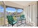 Screened-in balcony with seating area and views of the community at 716 Cordova Grn, Seminole, FL 33777