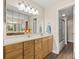 Spacious bathroom with a long vanity and ample storage space and a tiled shower at 716 Cordova Grn, Seminole, FL 33777
