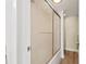 Tiled shower with sliding glass door and updated fixtures for a modern and clean look at 716 Cordova Grn, Seminole, FL 33777