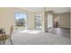 Cozy den with ample natural light and sliding glass doors leading to a balcony at 716 Cordova Grn, Seminole, FL 33777