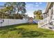 Spacious backyard featuring a playset and a white fence at 7403 S Obrien St, Tampa, FL 33616