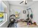 Bright exercise room with weights and a ceiling fan at 7403 S Obrien St, Tampa, FL 33616